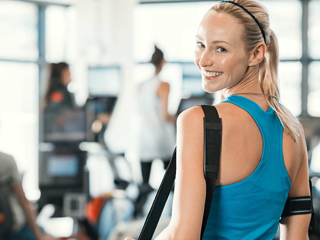 woman in gym with bag